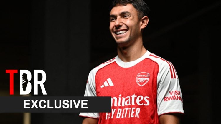 Image of Martin Zubimendi posing for a photo after signing for Arsenal, overlaid a TBR Exclusive banner