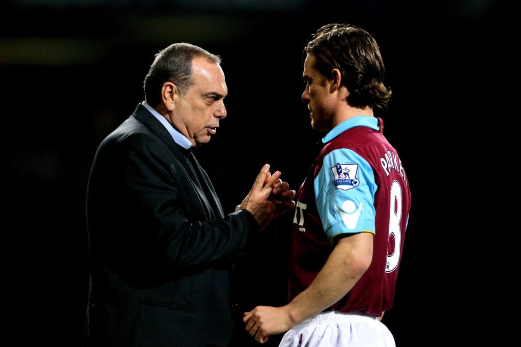 Avram Grant speaks with Scott Parker during West Ham United's match with Birmingham City
