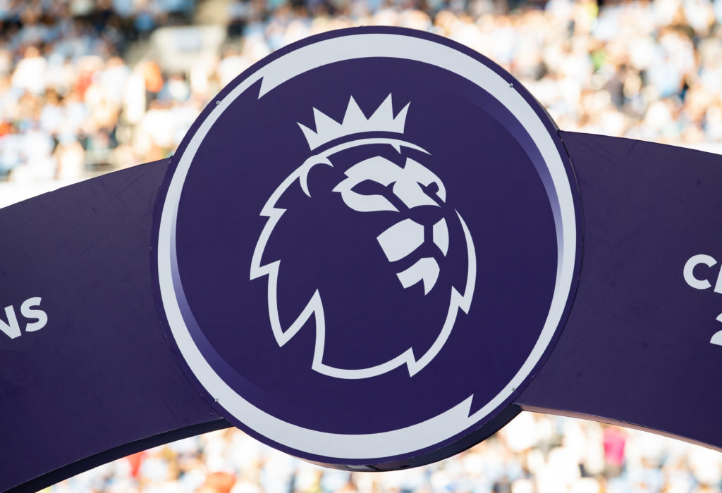 A closeup shot of the Premier League logo at a match between Manchester City and Chelsea