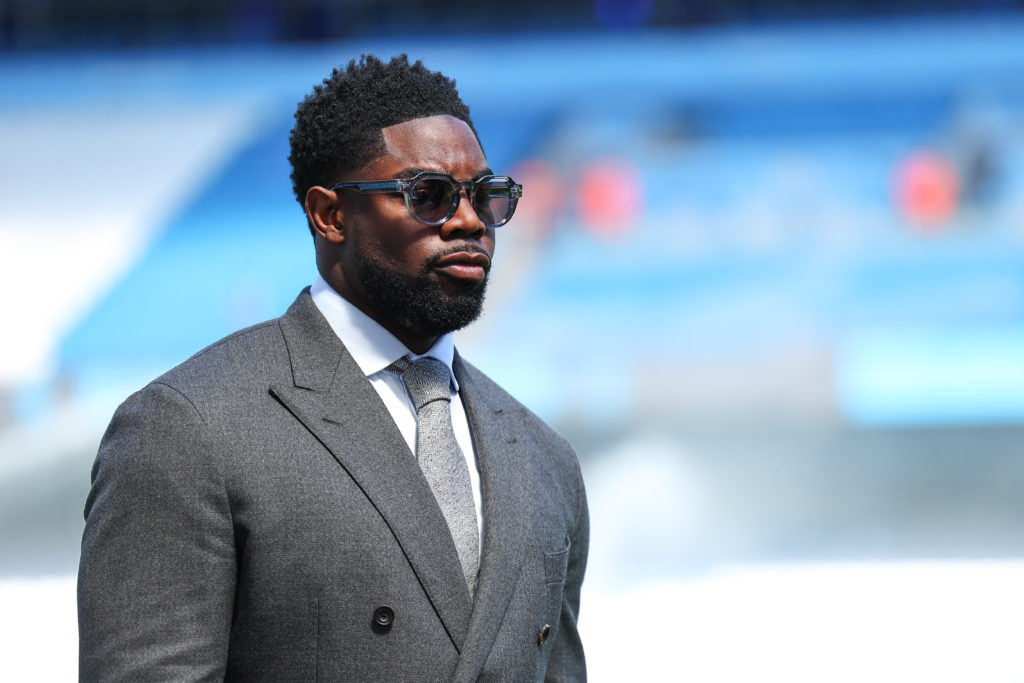 Micah Richards looks on before the Manchester City vs West Ham match in the Premier League