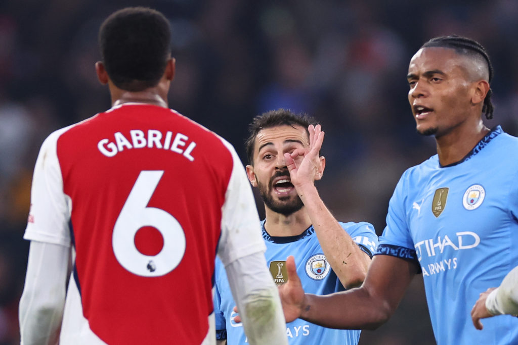 Bernardo Silva of Manchester City reacts towards Gabriel Magalhaes of Arsenal during the Premier League match between Manchester City FC and Arsenal FC at Etihad Stadium