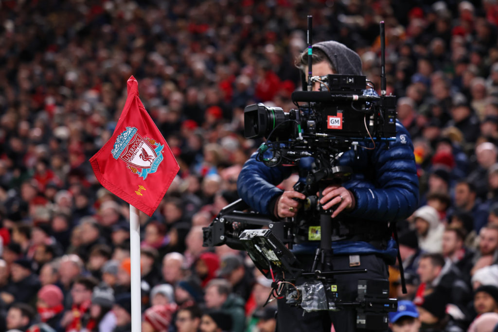 A cameraman takes footage as Liverpool face Real Madrid in the Champions League at Anfield