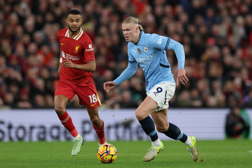 Manchester City's Norwegian striker #09 Erling Haaland runs with the ball during the English Premier League football match between Liverpool and Manchester City at Anfield in Liverpool, north west England on December 1, 2024.