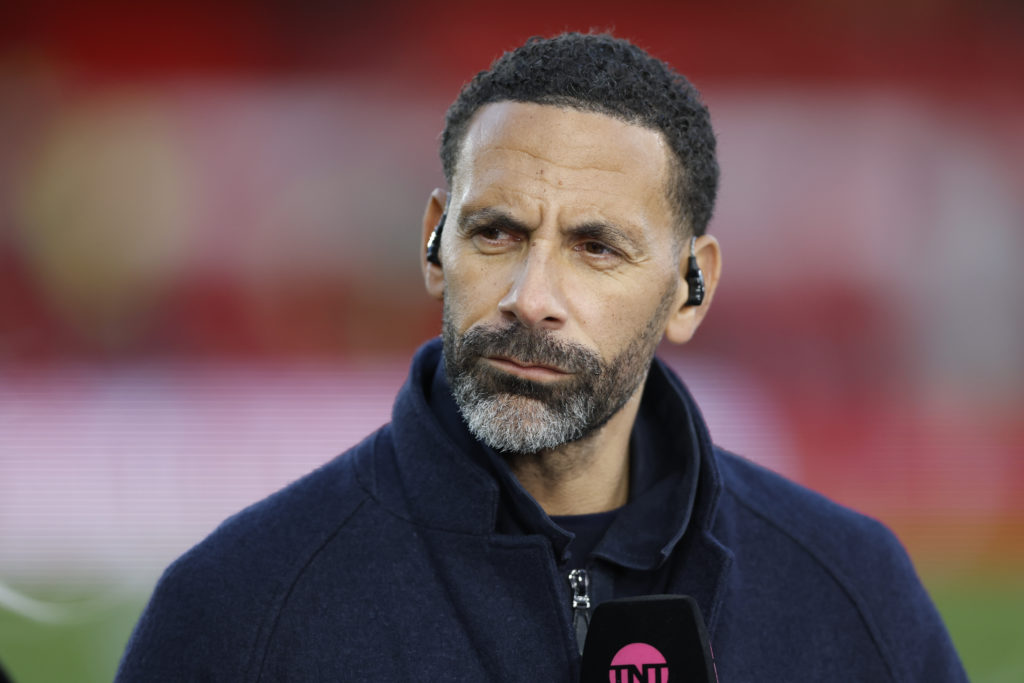 Rio Ferdinand is seen on punditry duties for TNT Sports at the City Ground