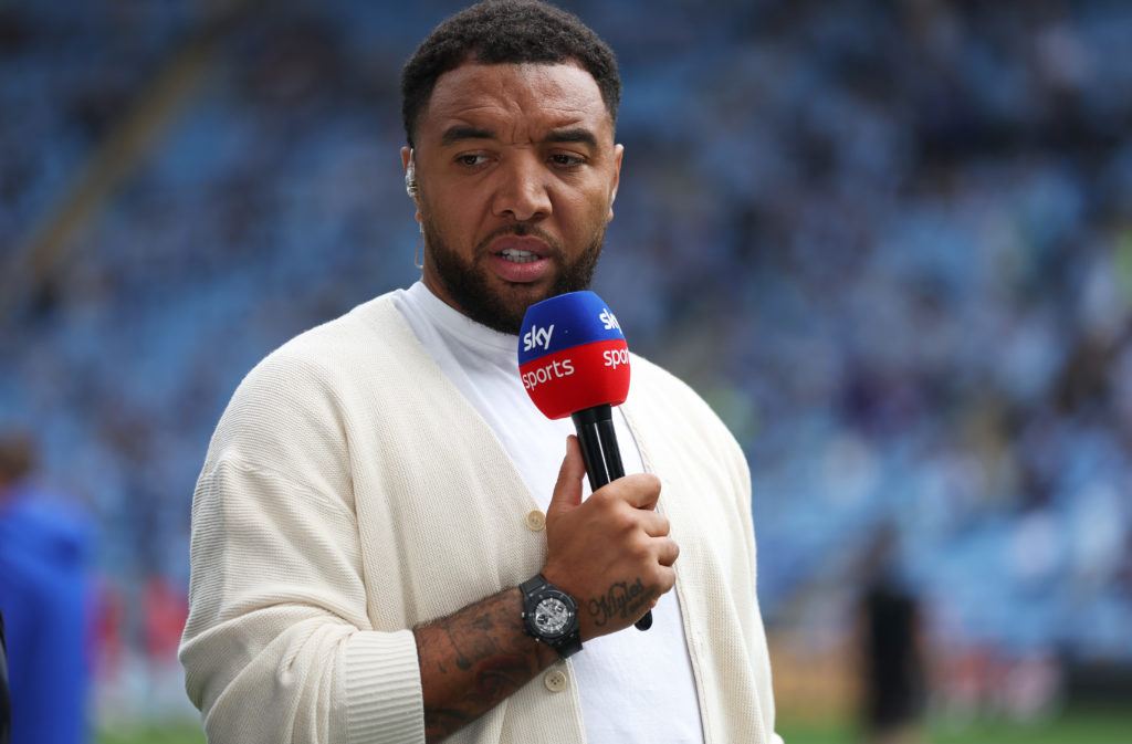 Troy Deeney holding a microphone while on punditry duties for Sky Sports