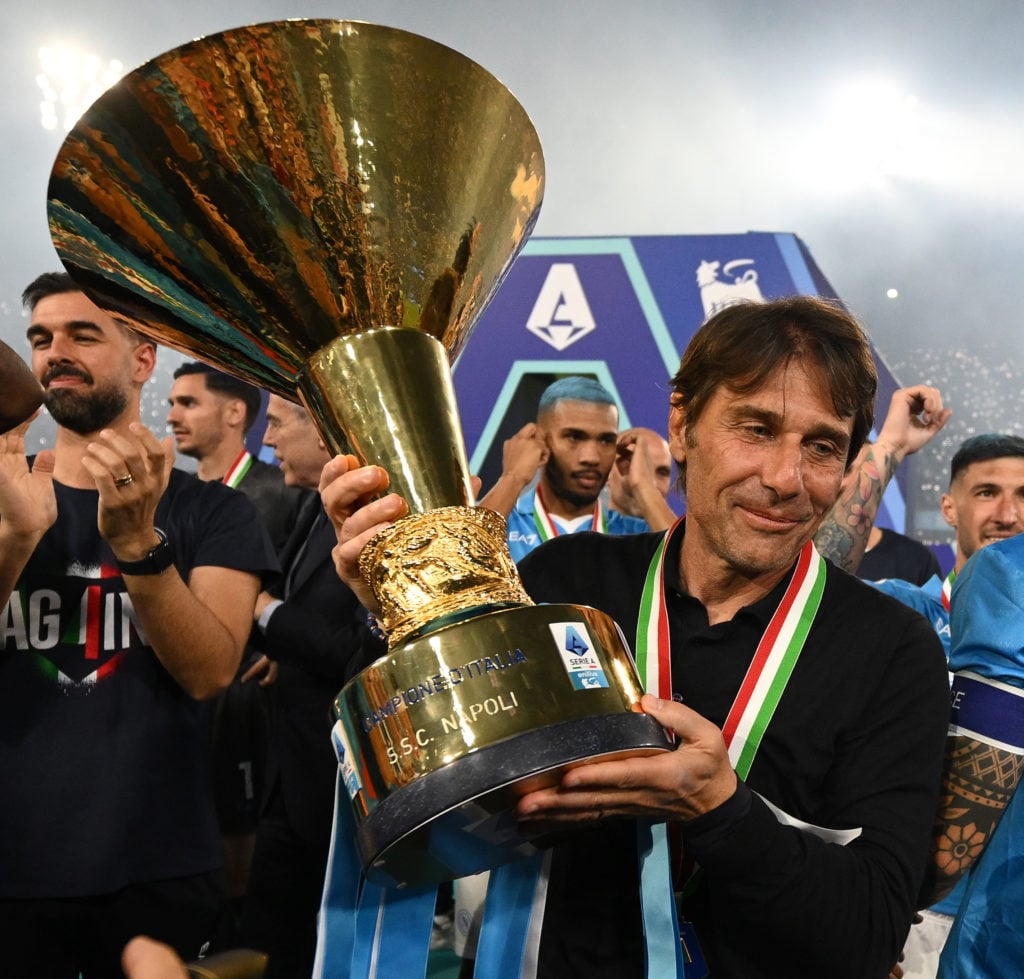 Antonio Conte of Napoli celebrates with the trophy at the end of the Serie A match between Napoli and Cagliari at Stadio Diego Armando Maradona