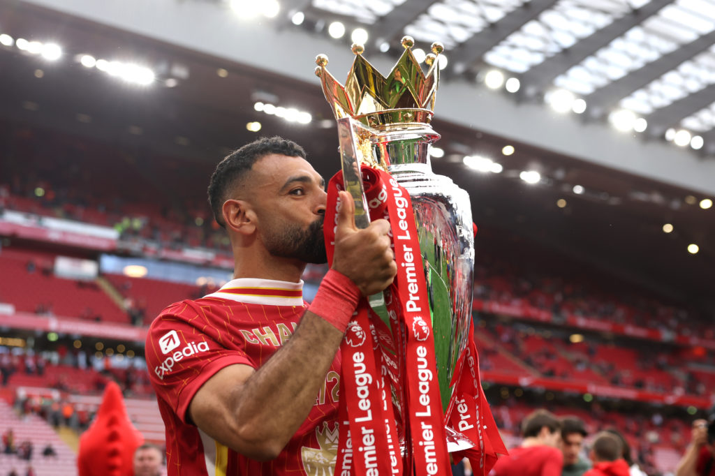 Mohamed Salah celebrates with the Premier League trophy