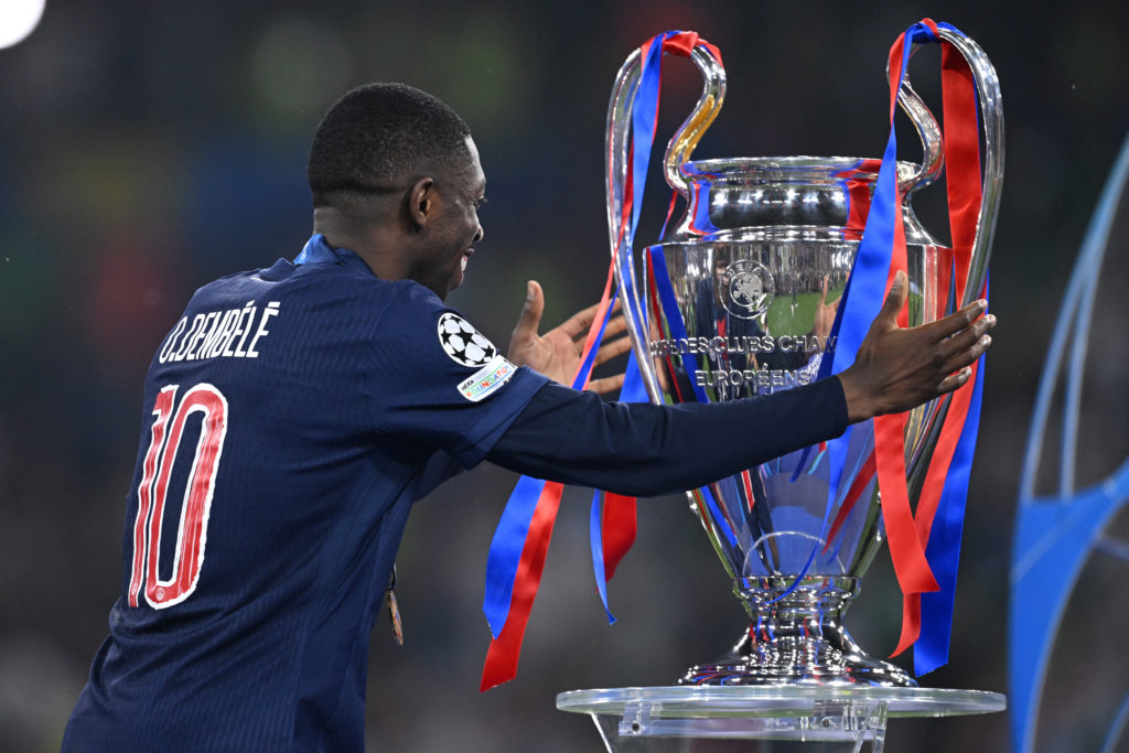 Ousmane Dembele celebrates with the Champions League trophy at PSG