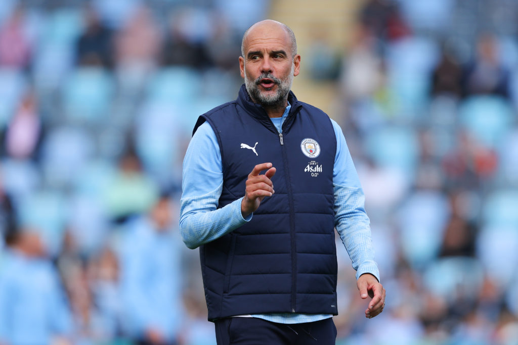 Pep Guardiola speaks during a Manchester City training session