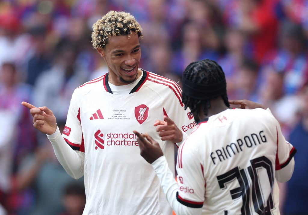 Hugo Ekitike of Liverpool celebrates scoring his team's first goal with teammate Jeremie Frimpong during the 2025 FA Community Shield match between Crystal Palace and Liverpool at Wembley Stadium on August 10, 2025