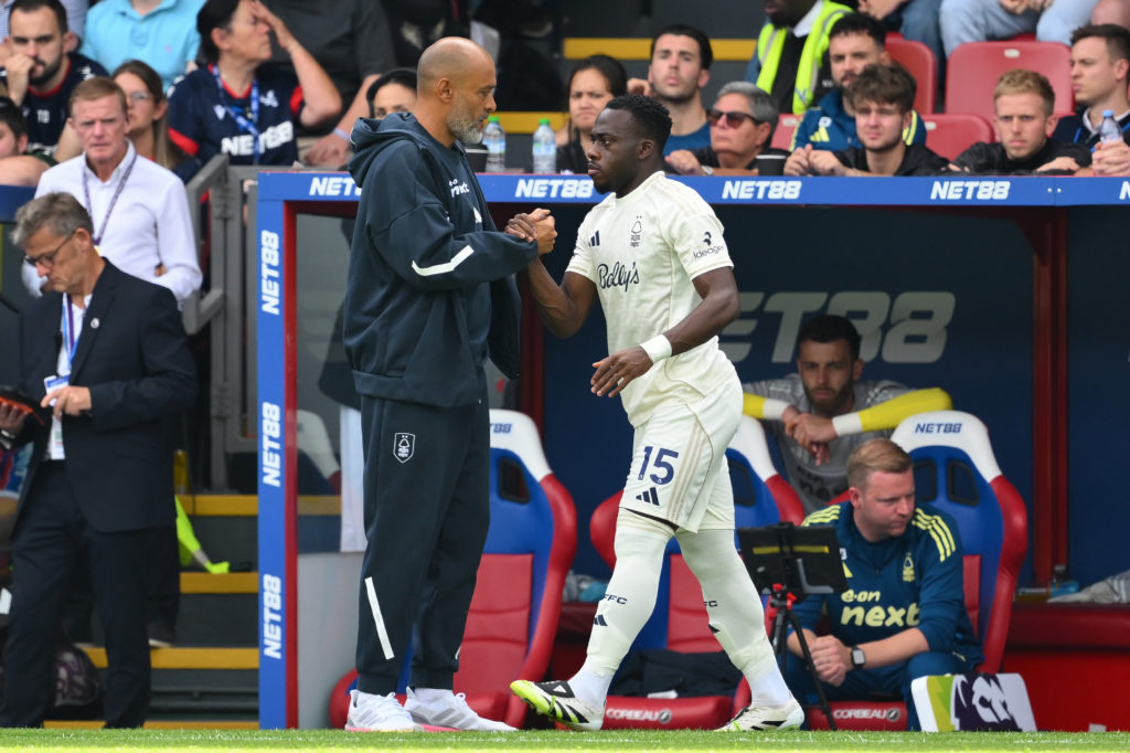 Nuno Espirito Santo greets Nottingham Forest striker Arnaud Kalimuendo