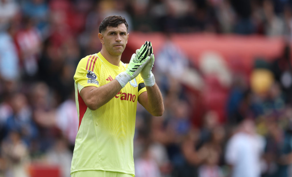 Emiliano Martínez of Aston Villa celebrates to his fans during the Premier League match between Brentford and Aston Villa at Gtech Community Stadium.