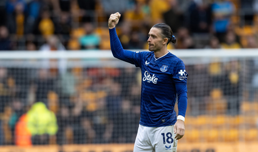 Jack Grealish looks on at the travelling Everton fans during a game against Wolves