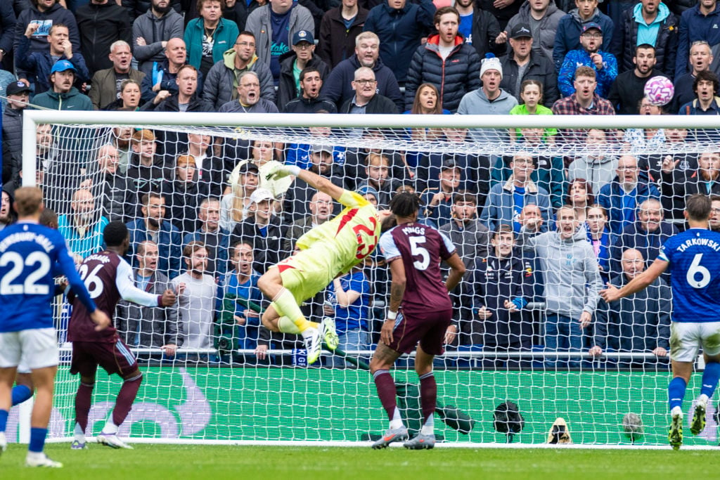 Emiliano Martinez #23 (GK) of Aston Villa F.C. makes a save during the Premier League match between Everton and Aston Villa at Hill Dickinson Stadium