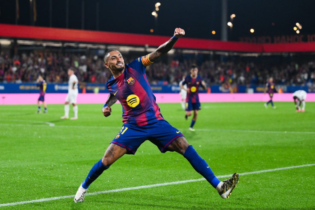 Raphinha celebrates scoring for Barcelona against Valencia in La Liga action