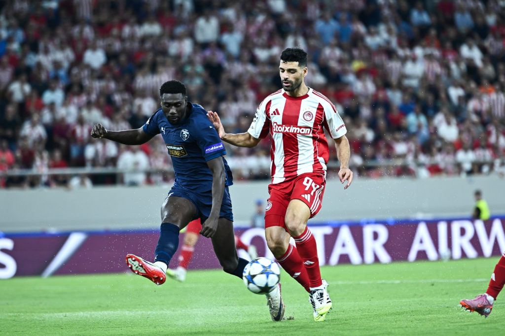 Mehdi Taremi challenges for the ball in Olympiacos vs Pafos