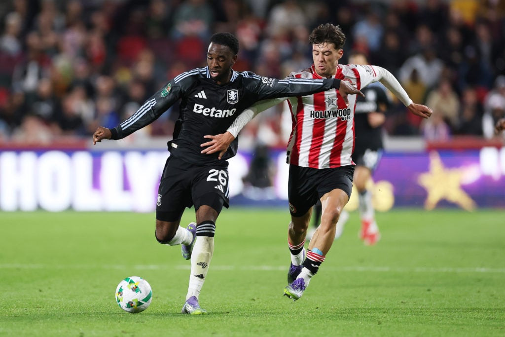 Lamare Bogarde of Aston Villa is challenged by Aaron Hickey of Brentford during the Carabao Cup Third Round match between Brentford and Aston Villa at Gtech Community Stadium on September 16, 2025