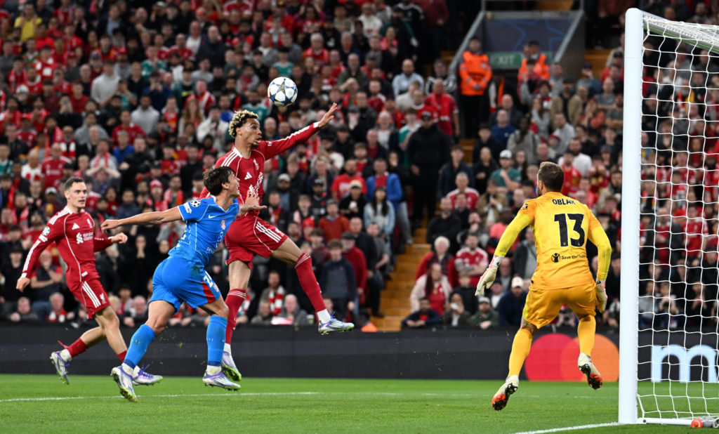 Hugo Ekitike of Liverpool wins a header over Robin Le Normand of Atletico de Madrid during the UEFA Champions League 2025/26 League Phase MD1 match between Liverpool FC and Atletico de Madrid at Anfield on September 17, 2025