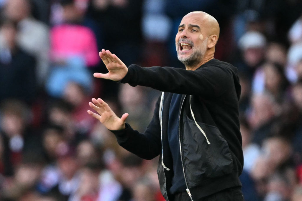 Pep Guardiola gestures during Arsenal vs Man City
