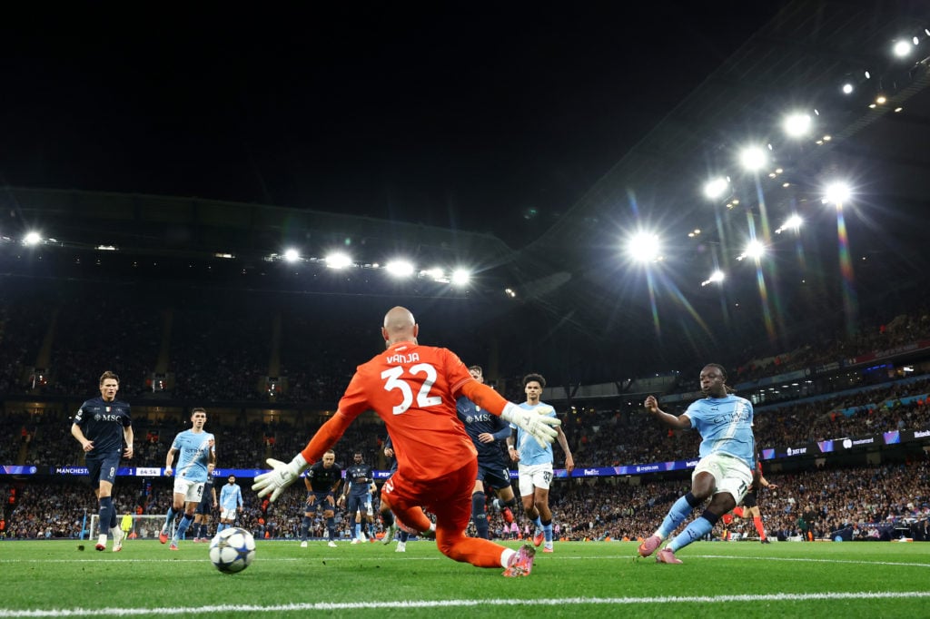 Jeremy Doku of Manchester City scores his team's second goal past Vanja Milinkovic-Savic of Napoli during the UEFA Champions League 2025/26 League Phase MD1 match between Manchester City and SSC Napoli at City of Manchester Stadium on September 18, 2025