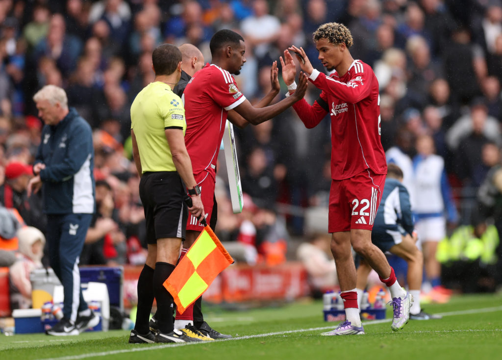 Alexander Isak of Liverpool comes on as a substitute for teammate Hugo Ekitike during the Premier League match between Liverpool and Everton