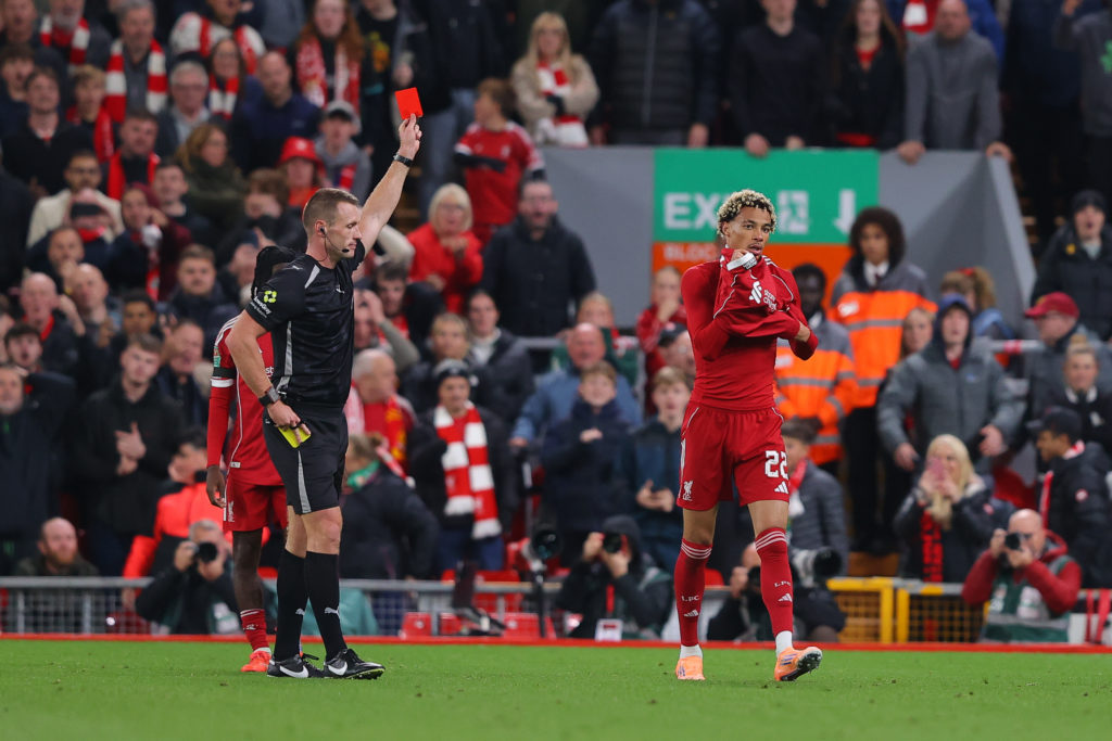 Hugo Ekitike of Liverpool is shown a red card after scoring their side's second goal during the Carabao Cup Third Round match between Liverpool and Southampton at Anfield.