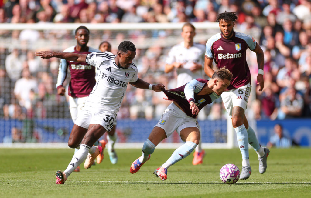 Matty Cash challenges Ryan Sessegnon for the ball during Aston Villa vs Fulham