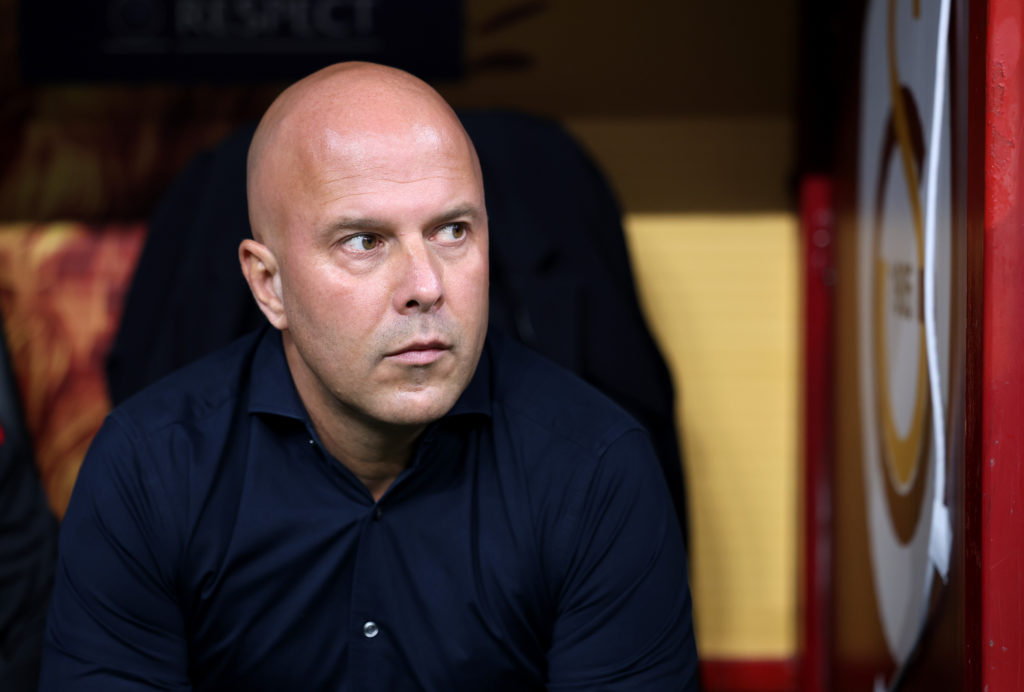 Liverpool boss Arne Slot sits in the dugout ahead of the Champions League defeat against Galatasaray