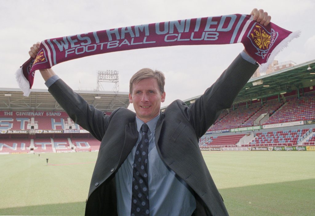 Glenn Roeder is announced as the new West Ham manager, holding a club scarf