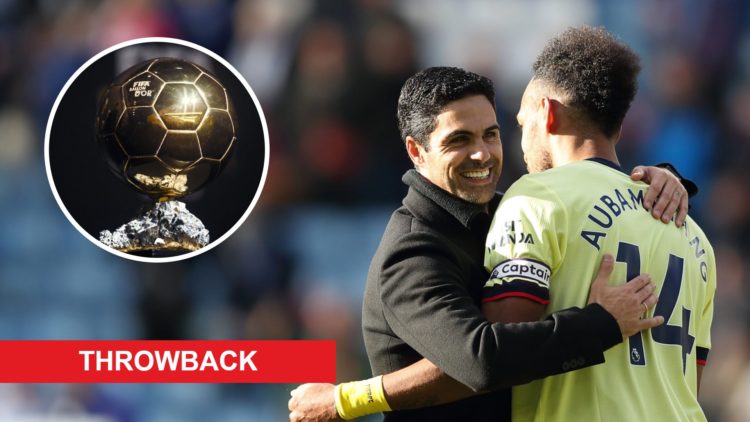 Pierre-Emerick Aubameyang embraces Arsenal manager Mikel Arteta alongside an image of the Ballon d'Or