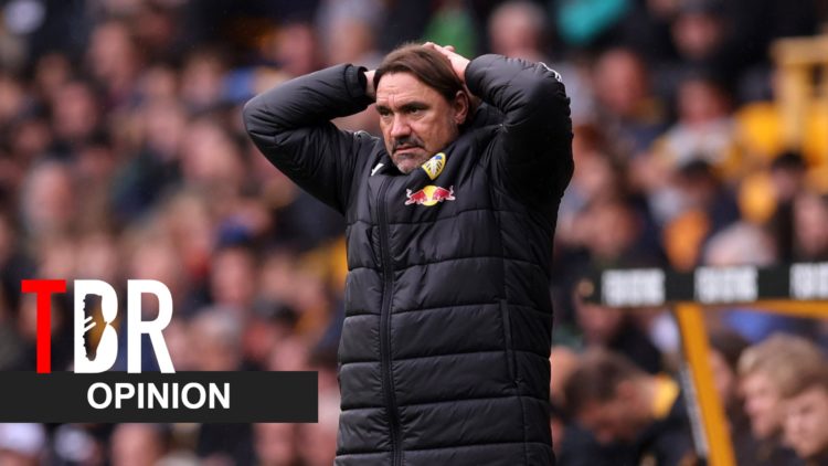 Daniel Farke reacts during a Leeds United match alongside an opinion banner and the TBR Football logo