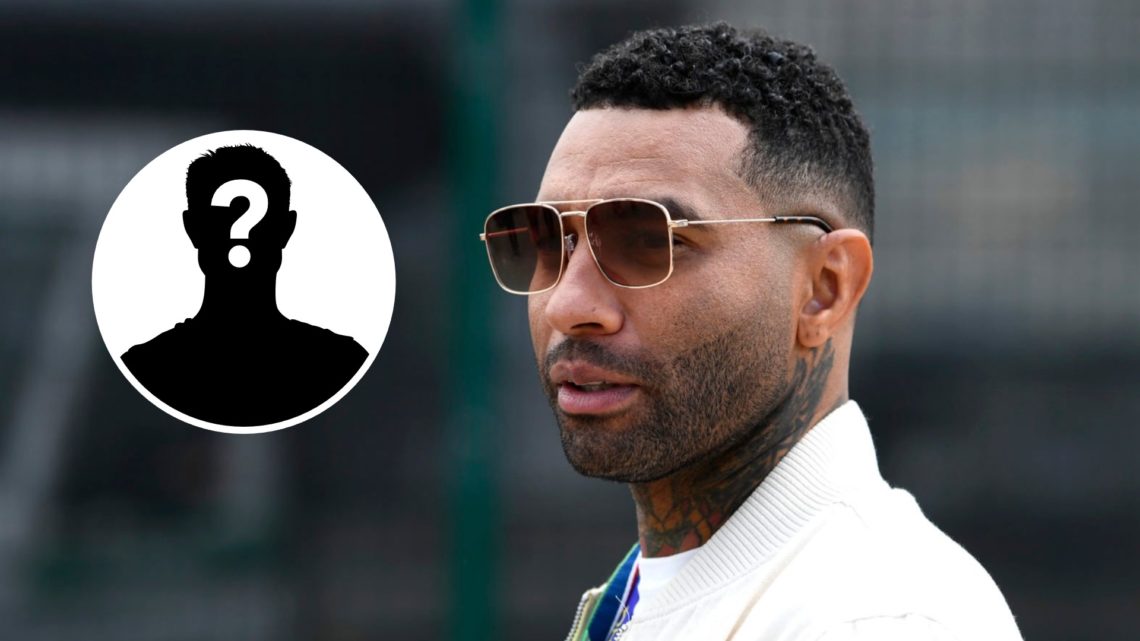 Jermaine Pennant looks on in the pitlane prior to the F1 Grand Prix of Great Britain at Silverstone (Right) Mystery (Left).