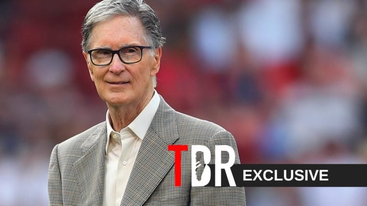 Boston Red Sox principal owner John Henry walks off the field at Fenway Park after a Red Sox Scholars ceremony.