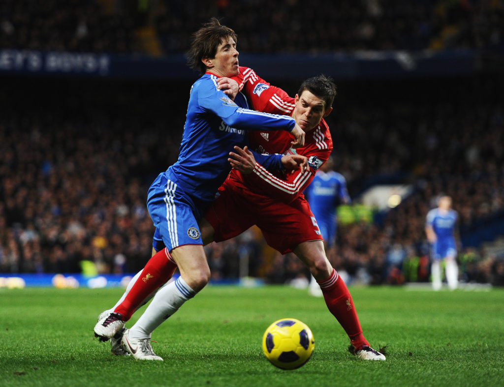 Fernando Torres of Chelsea is challenged by Daniel Agger of Liverpool during the Barclays Premier League match between Chelsea and Liverpool at Stamford Bridge.