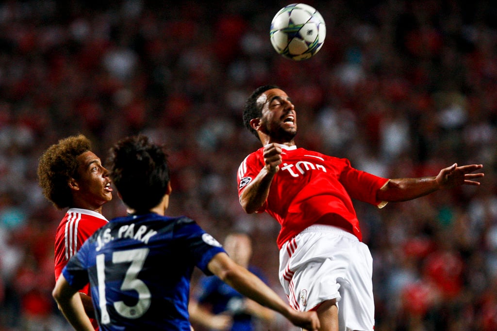 Benfica midfielder Ruben Amorim heads the ball during a Champions League match against Manchester United in 2011