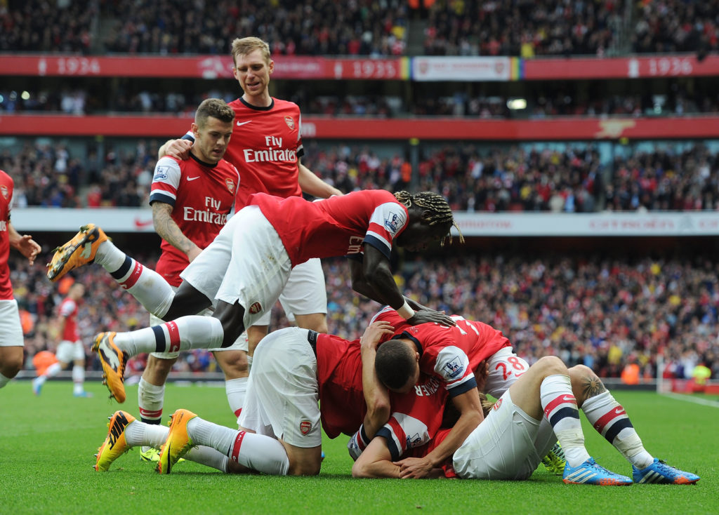 Arsenal players celebrate after scoring vs Norwich City