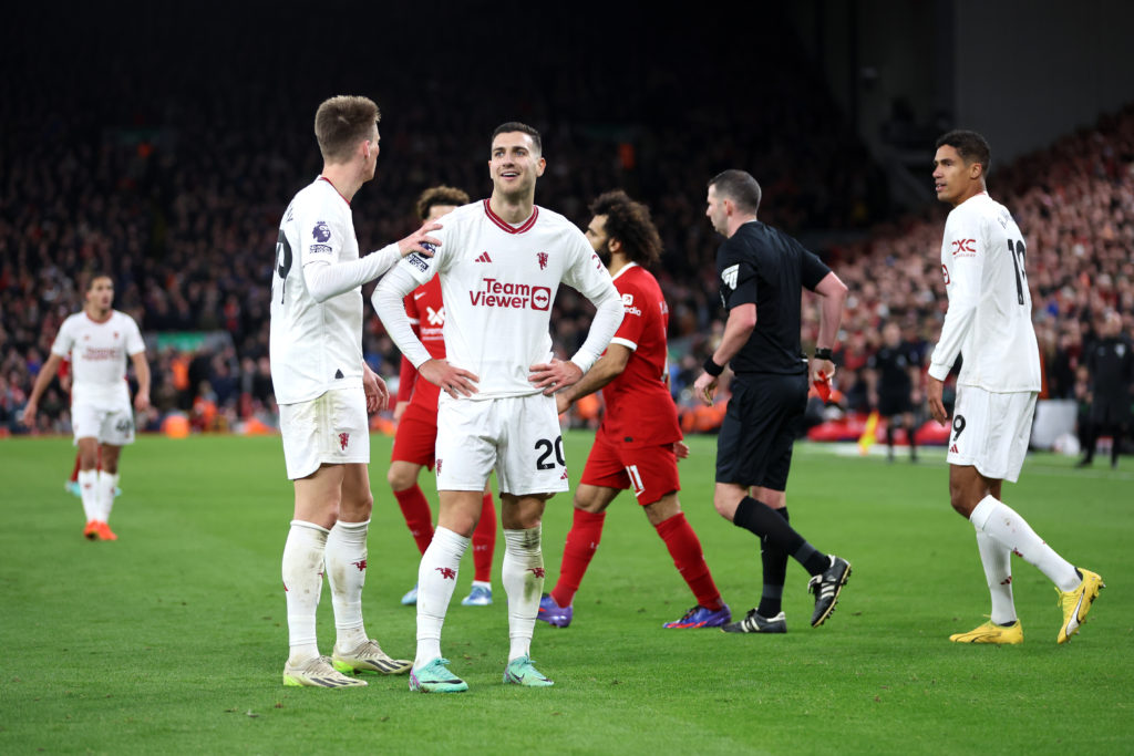 Manchester United full-back Diogo Dalot reacts after being sent off against Liverpool at Anfield