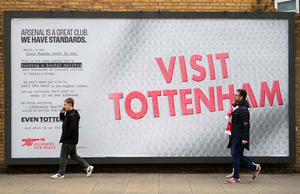 A billboard outside the Emirates Stadium reads 'Visit Tottenham', satirising Arsenal's sponsorship deal with Visit Rwanda