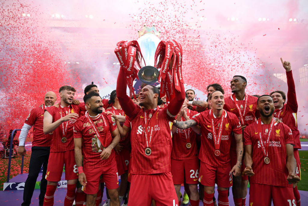 Virgil van Dijk lifts the Premier League trophy after Liverpool were crowned champions at Anfield