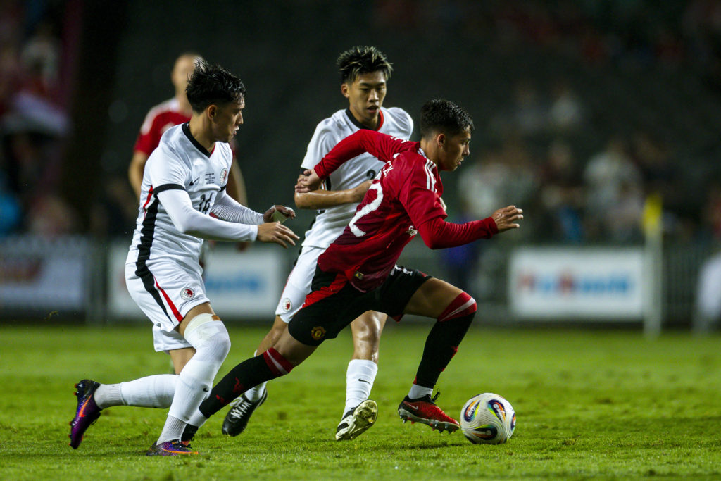 Shea Lacey runs with the ball during Manchester United's friendly match against Hong Kong