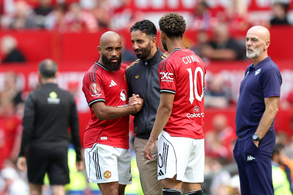 Bryan Mbeumo, Matheus Cunha and Ruben Amorim speak during a Manchester United match