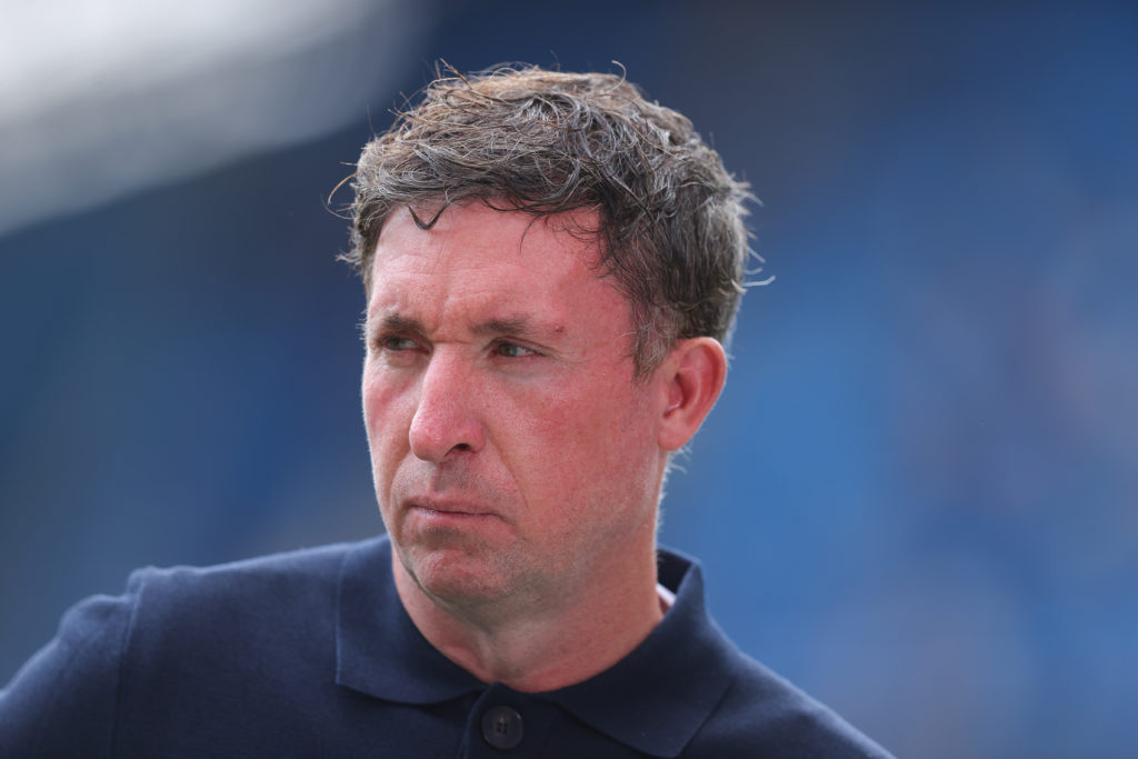 TV pundit Robbie Fowler in front of the cameras during the Premier League match between Manchester City and Tottenham at the Etihad Stadium
