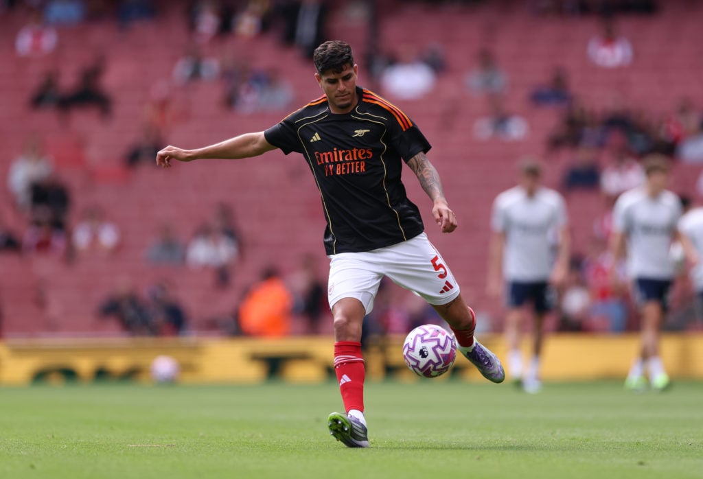 Piero Hincapie warming up for Arsenal's Premier League match.
