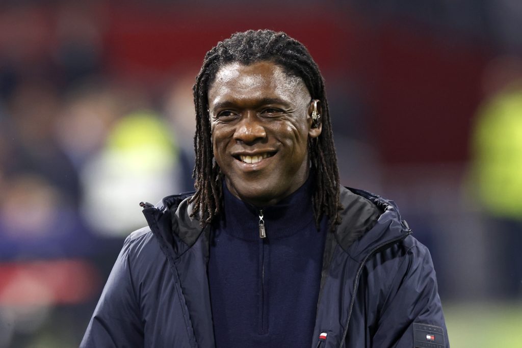 TV pundit Clarence Seedorf smiles before the Champions League match between Ajax and Inter Milan