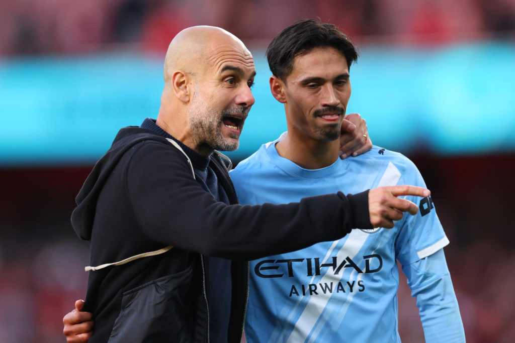 Pep Guardiola the head coach / manager of Manchester City with Tijjani Reijnders during the Premier League match