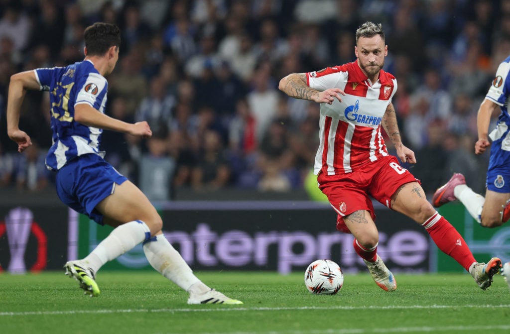 Crvena Zvezda Beograd's Austrian forward #89 Marko Arnautovic (R) and FC Porto's Croatian defender #21 Dominik Prpic fight for the ball