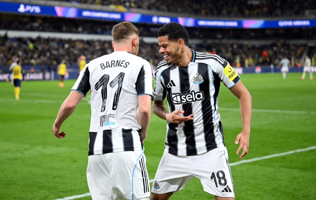 William Osula celebrates with Harvey Barnes after his assist in the Champions League for Newcastle United