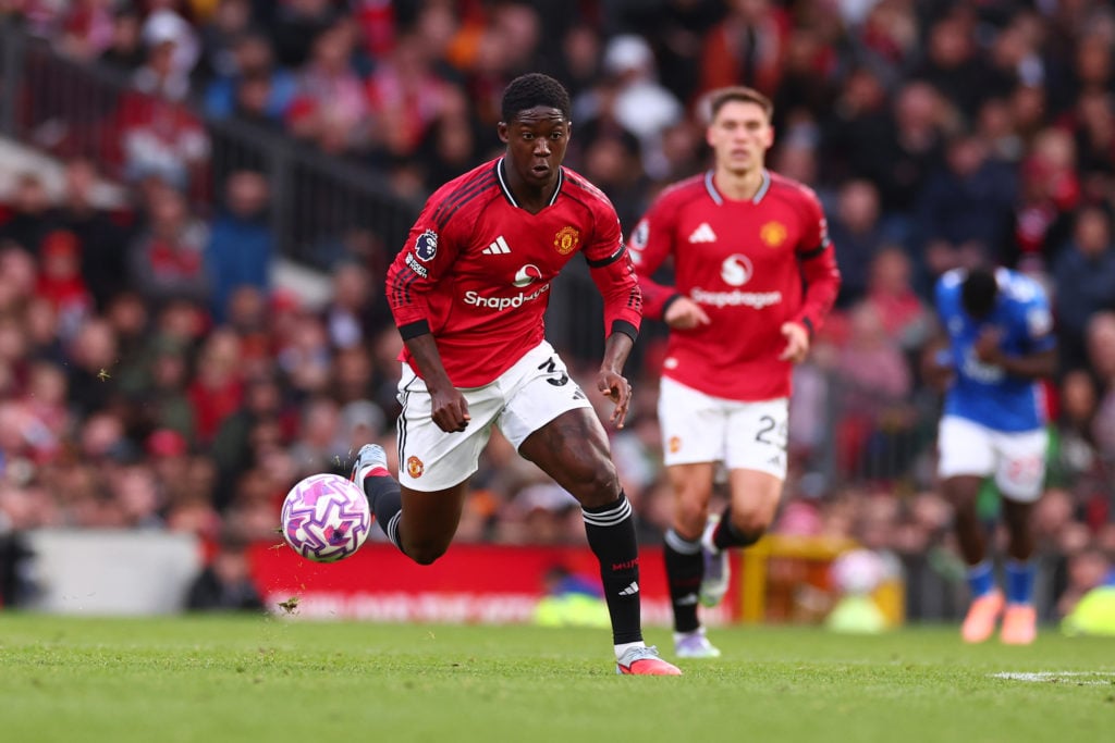 Kobbie Mainoo runs with the ball during Manchester United v Sunderland in the Premier League at Old Trafford