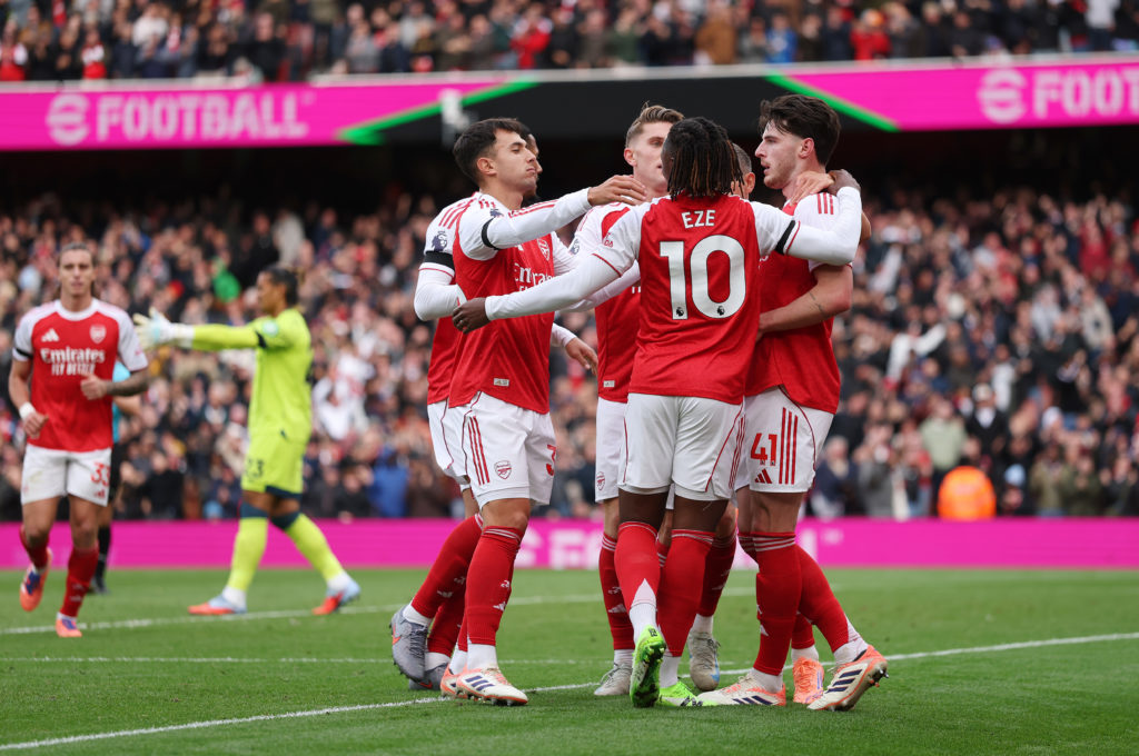 Arsenal players celebrate after scoring against West Ham