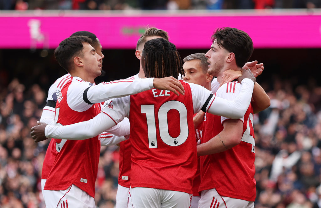 Arsenal players celebrate after scoring against West Ham